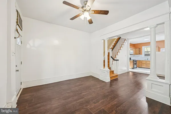 a view of an entryway with wooden floor