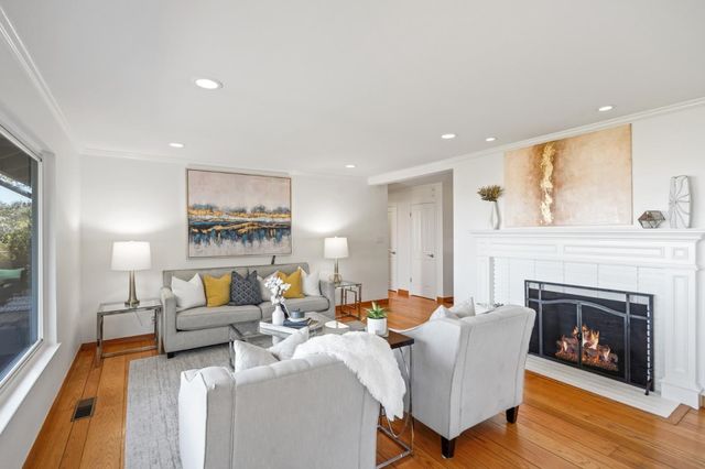 a bedroom with a large bed and a large window