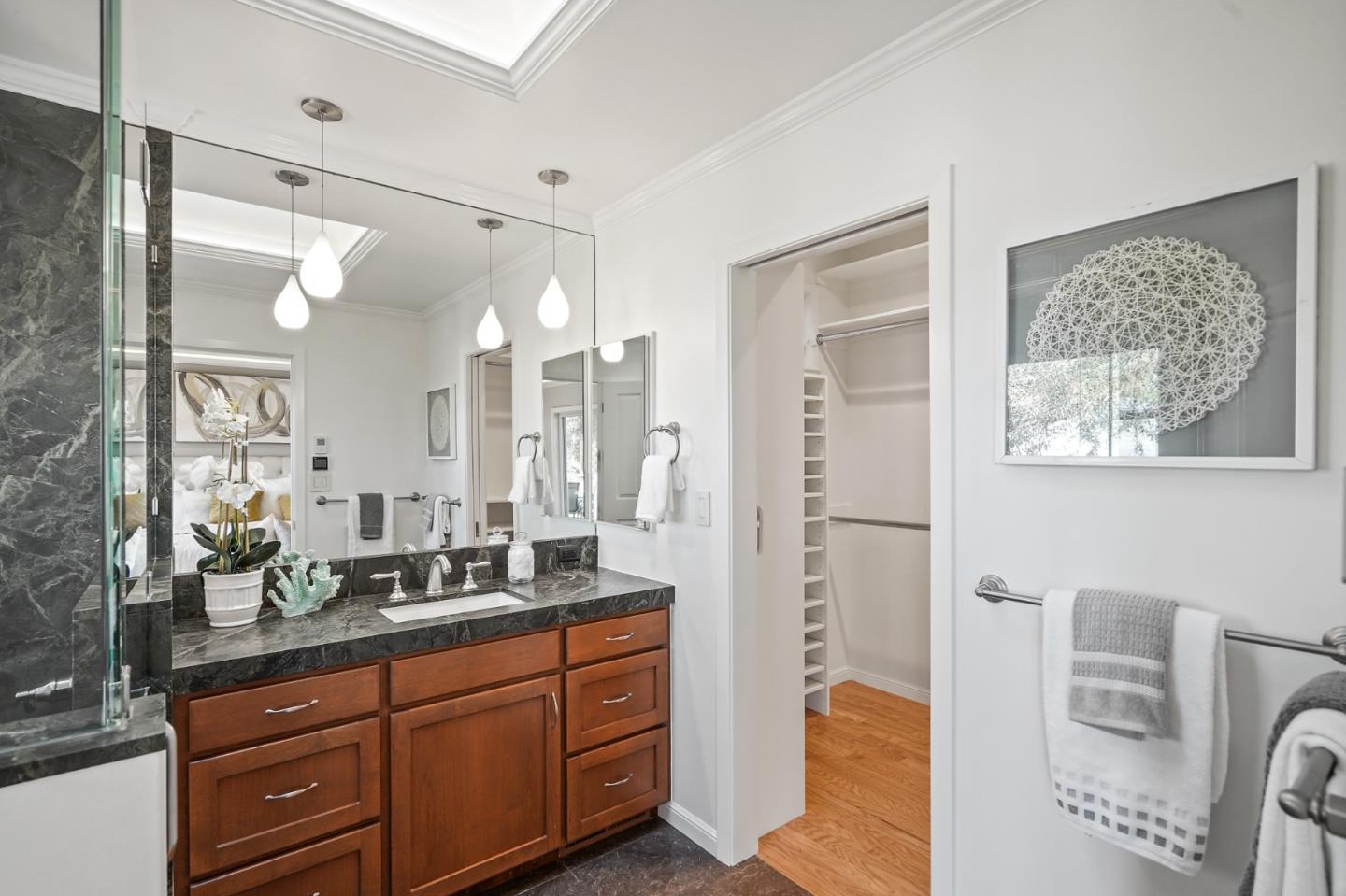 22 Del Rey Court San Carlos, CA 94070 - Photo 19 of 47 a spacious bathroom with a granite countertop sink mirror and a shower