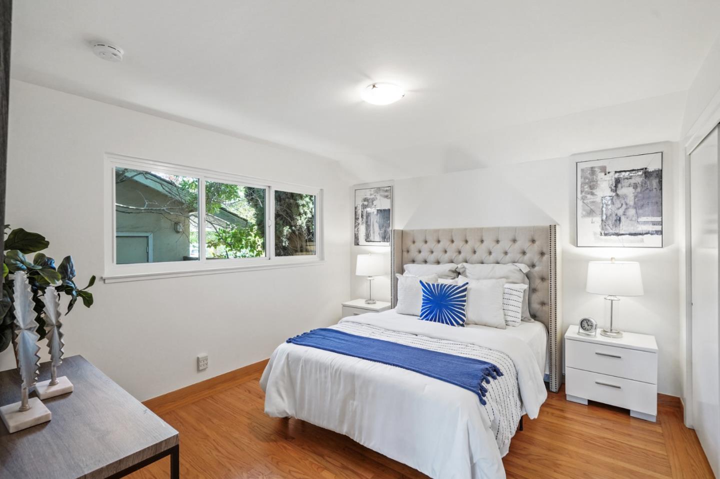 22 Del Rey Court San Carlos, CA 94070 - Photo 22 of 47 a bedroom with a bed and wooden floor