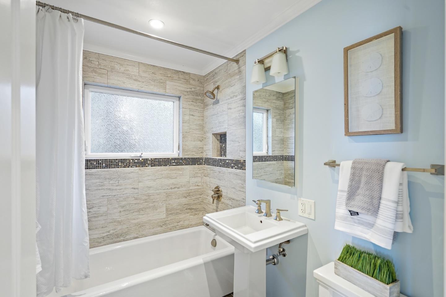22 Del Rey Court San Carlos, CA 94070 - Photo 27 of 47 a bathroom with a sink mirror and a bathtub
