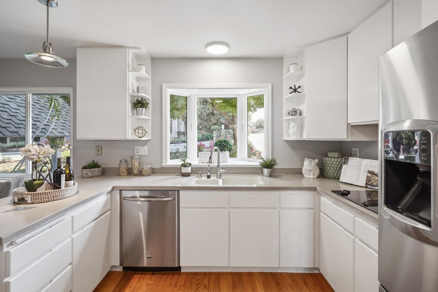 22 Del Rey Court San Carlos, CA 94070 - Photo 7 of 47 a kitchen with sink cabinets and window