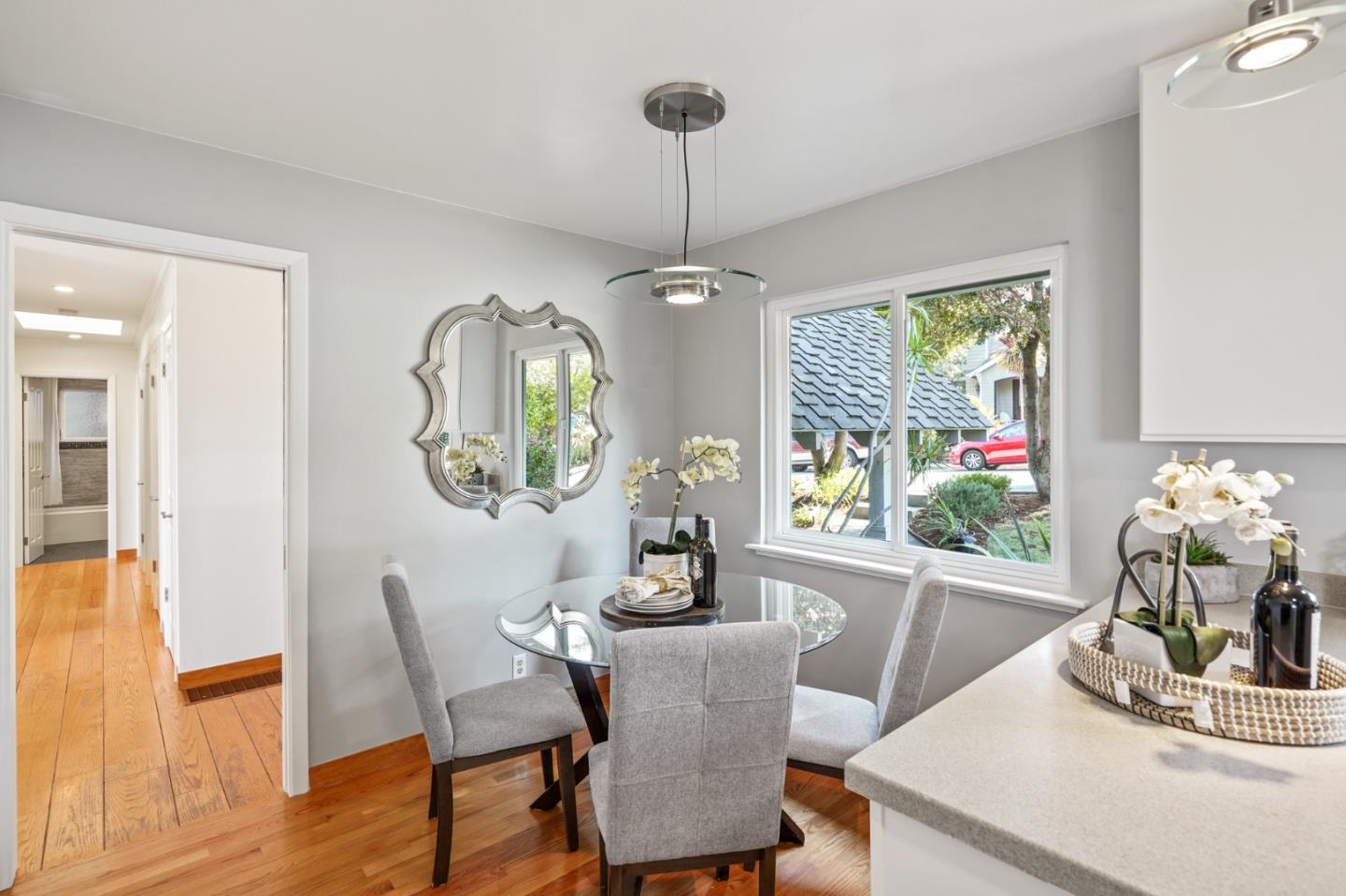 22 Del Rey Court San Carlos, CA 94070 - Photo 10 of 47 a dining room with furniture a window and a chandelier