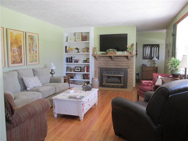 5385 Awalt Road Tullahoma, TN 37388 - Photo 3 of 20 Formal Living Room with built ins, fireplace, gas logs, HW floors, replacement windows and warm paint colors