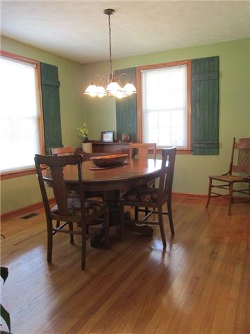 5385 Awalt Road Tullahoma, TN 37388 - Photo 5 of 20 Formal Dining Room with hardwood floors, replacement windows, indoor shutters (can remain), updated light fixture and new circuit breaker box