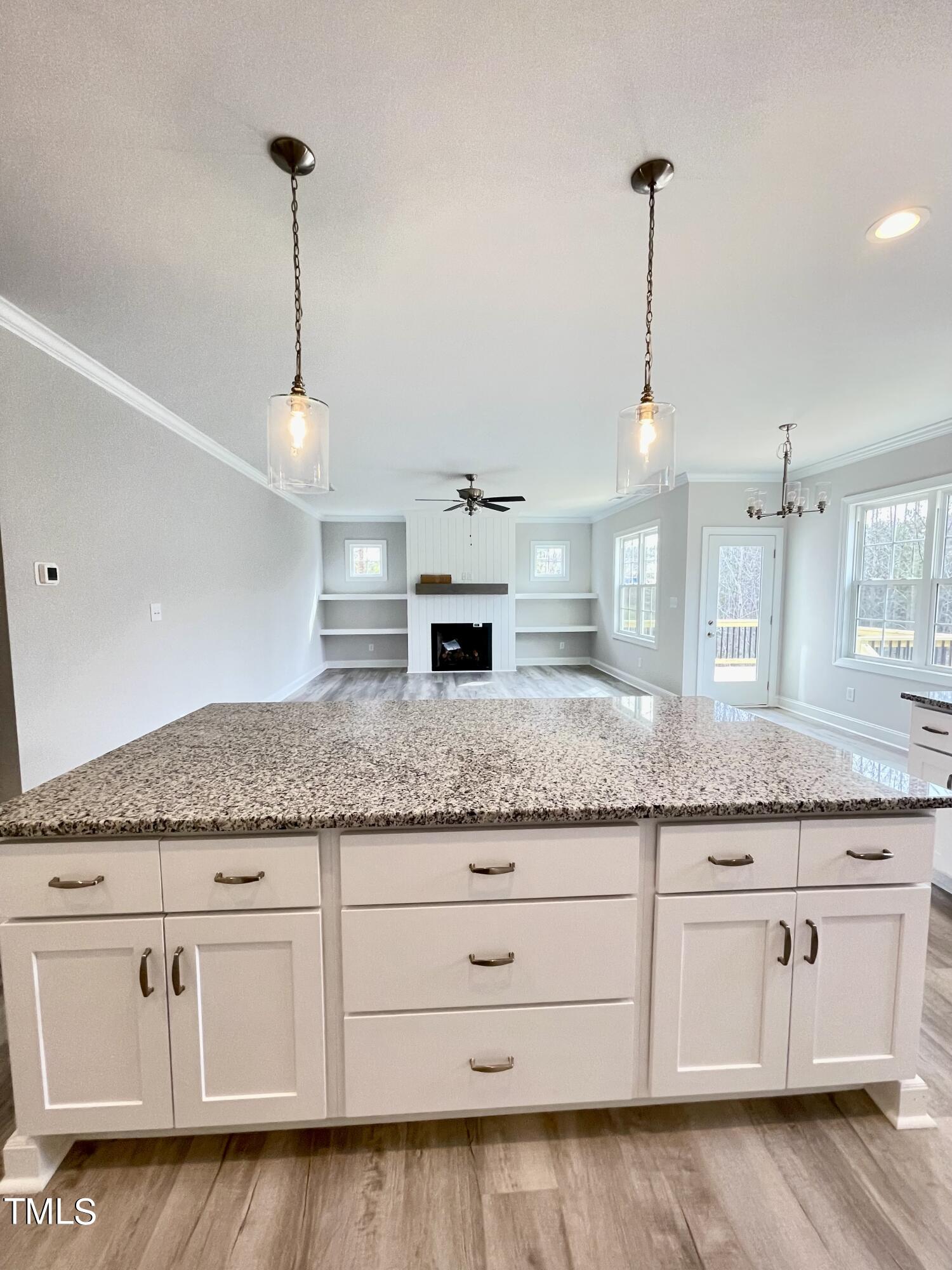 35 Sunrise Court Spring Hope, NC 27882 - Photo 11 of 18 a kitchen with granite countertop white cabinets and white appliances