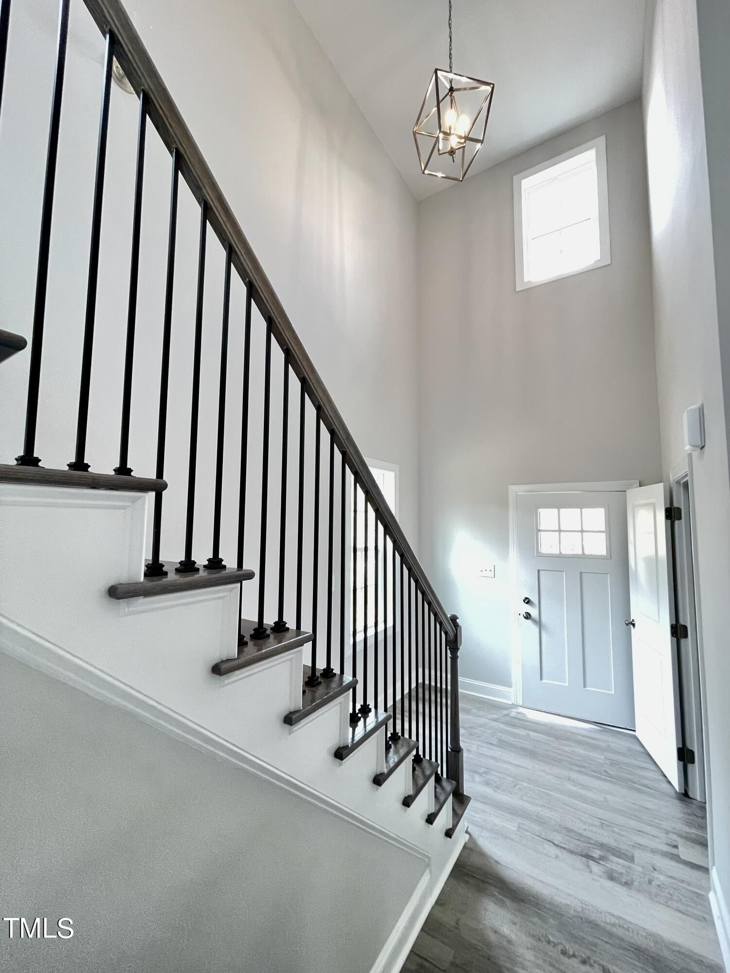 35 Sunrise Court Spring Hope, NC 27882 - Photo 5 of 18 a view of staircase with railing and a chandelier