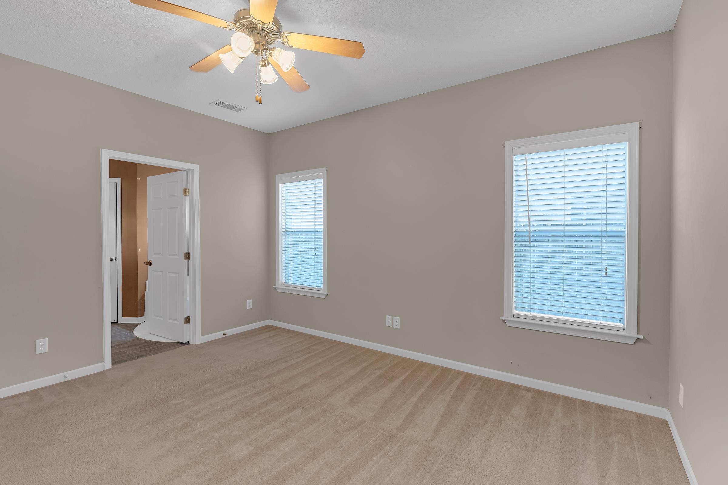 1229 North Sanga Road Memphis, TN 38016 - Photo 11 of 32 Spare room featuring light carpet and a ceiling fan