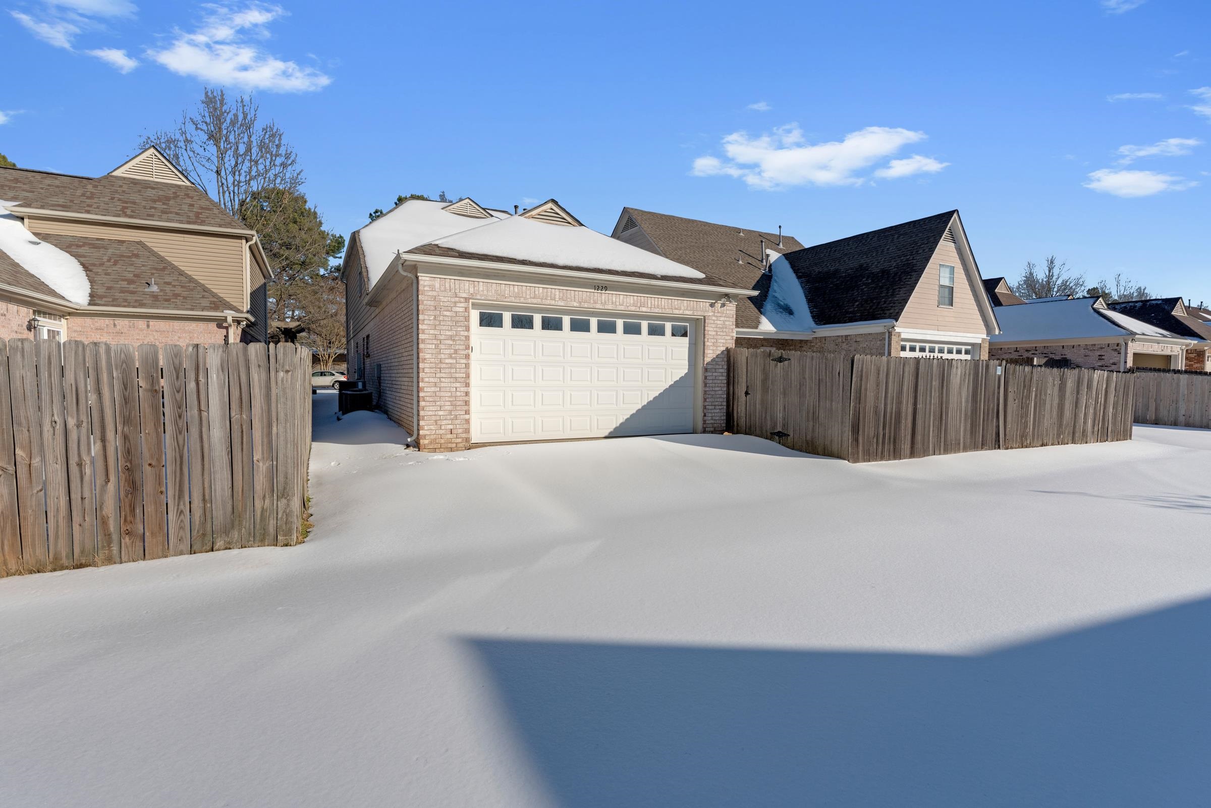 1229 North Sanga Road Memphis, TN 38016 - Photo 27 of 32 View of front of house with a garage and brick siding