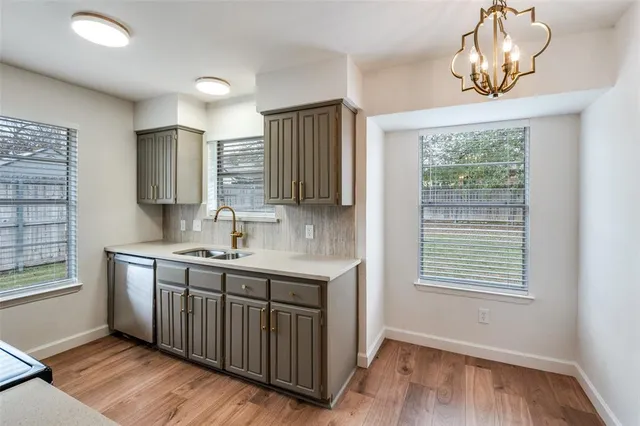 a living room with furniture a ceiling fan and a window