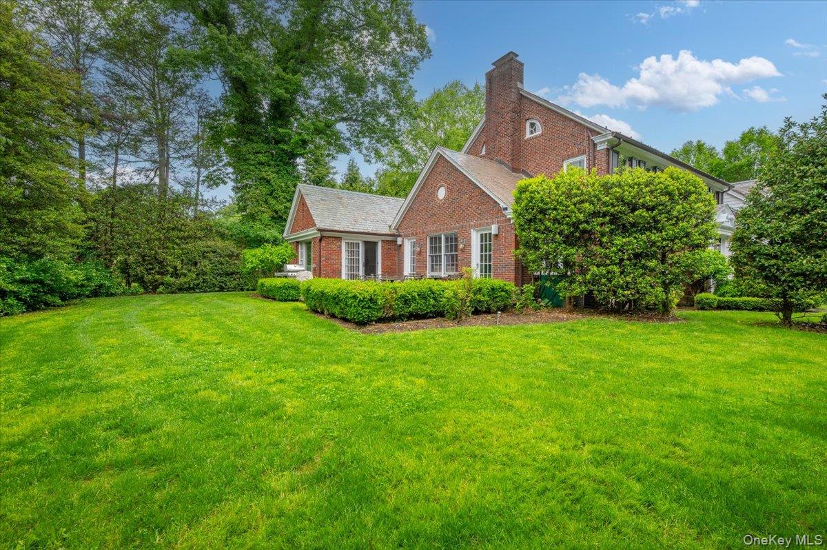 7 Harcourt Road Scarsdale, NY 10583 - Photo 2 of 34 a front view of a house with a yard