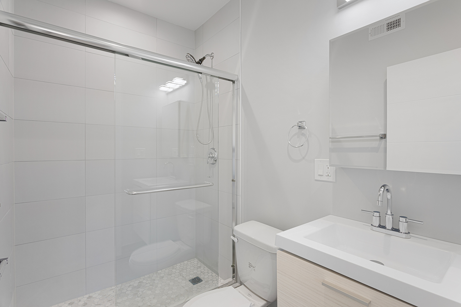1548 West Juneway Terrace, Unit 2B Chicago, IL 60626 - Photo 12 of 17 a bathroom with a sink toilet and shower