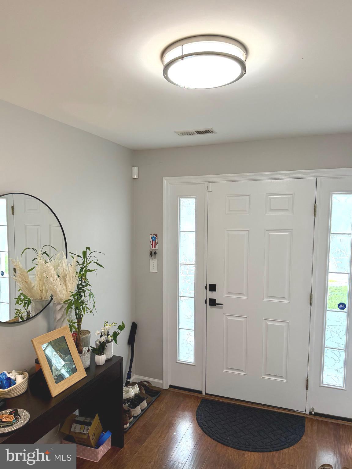 7108 Wheeling Way Gainesville, VA 20155 - Photo 38 of 45 a view of a room with wooden floor and lounge chair
