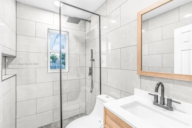 a bathroom with a sink and a shower