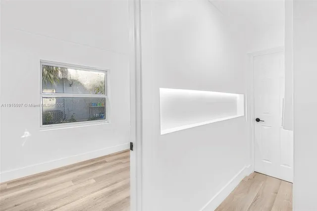 a view of a room that has a window