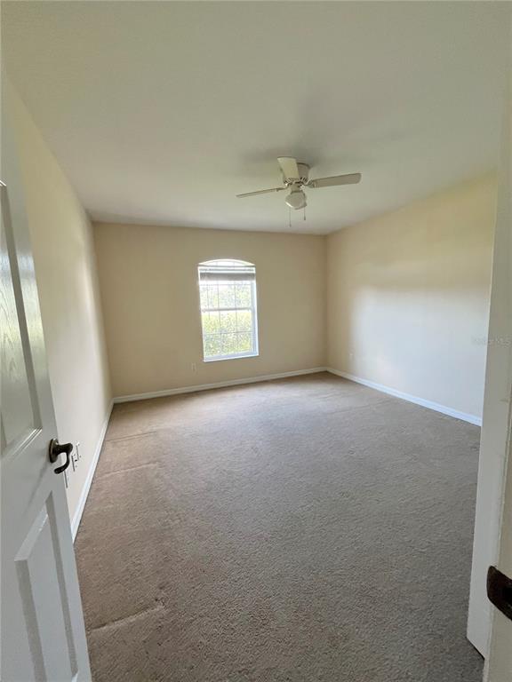 4420 Southwest 100th Street Ocala, FL 34476 - Photo 12 of 22 a view of an empty room with a window