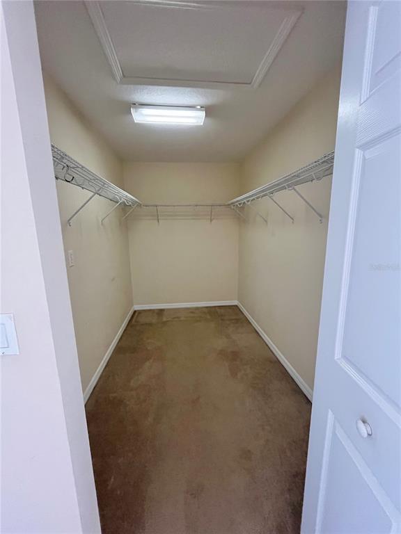 4420 Southwest 100th Street Ocala, FL 34476 - Photo 16 of 22 a view of a room with racks on the wall