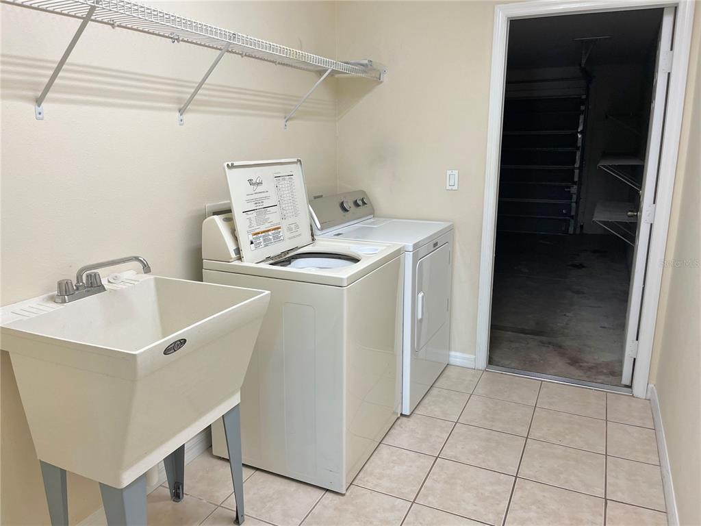 4420 Southwest 100th Street Ocala, FL 34476 - Photo 19 of 22 a utility room with cabinets