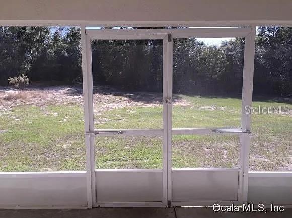 4420 Southwest 100th Street Ocala, FL 34476 - Photo 21 of 22 a view of a glass door