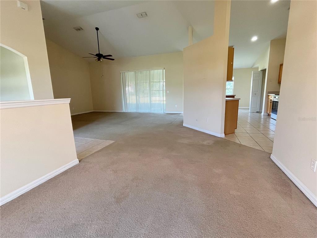 4420 Southwest 100th Street Ocala, FL 34476 - Photo 10 of 22 a view of a hallway with a kitchen
