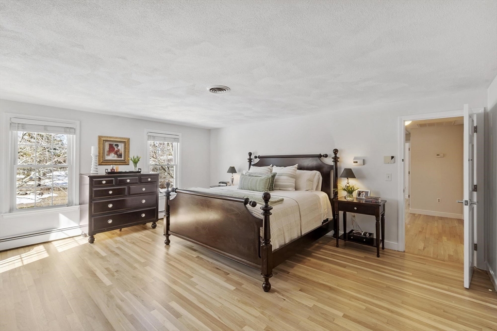 2 Greybirch Road Andover, MA 01810 - Photo 21 of 41 a bedroom with a bed and wooden floor
