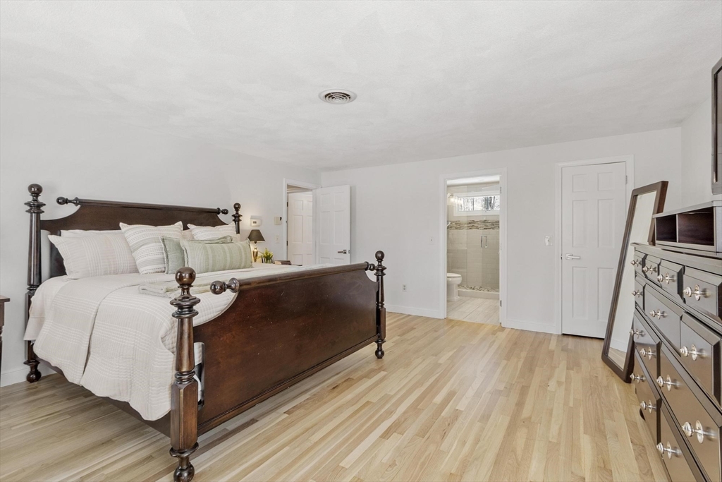 2 Greybirch Road Andover, MA 01810 - Photo 22 of 41 a room with a bed and a flat screen tv