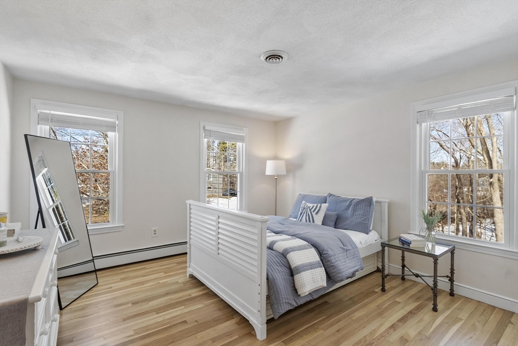 2 Greybirch Road Andover, MA 01810 - Photo 27 of 41 a bedroom with a bed wooden floor and window