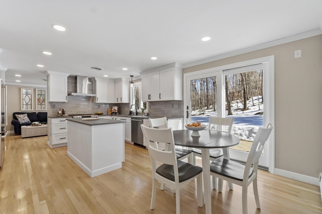 2 Greybirch Road Andover, MA 01810 - Photo 3 of 41 a kitchen with a table and chairs in it