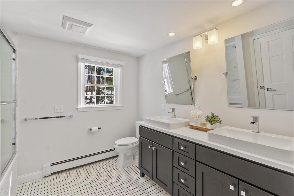 2 Greybirch Road Andover, MA 01810 - Photo 31 of 41 a spacious bathroom with a double vanity sink a mirror and a toilet