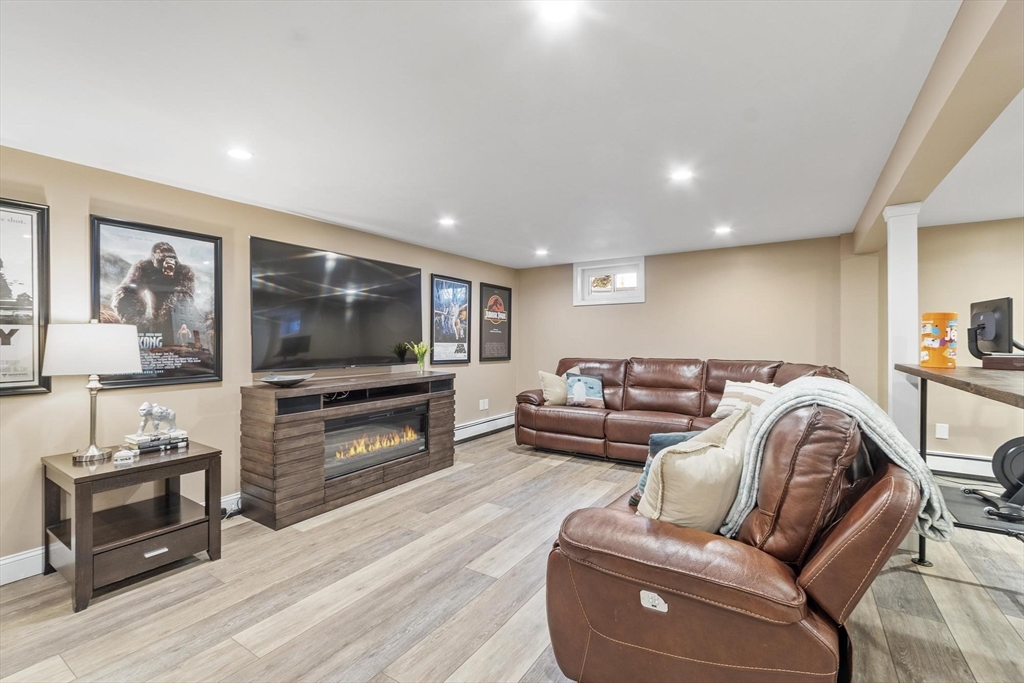 2 Greybirch Road Andover, MA 01810 - Photo 32 of 41 a living room with furniture and a flat screen tv