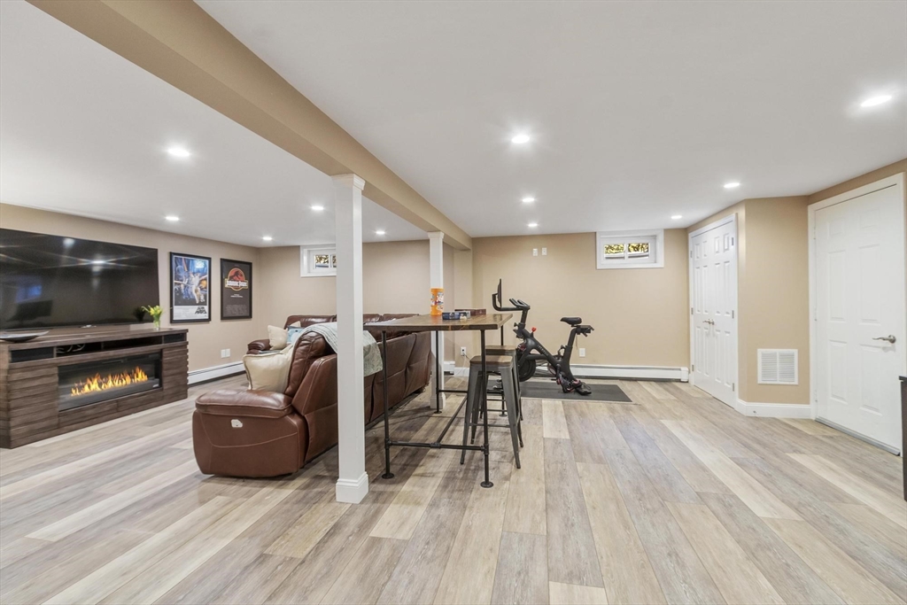 2 Greybirch Road Andover, MA 01810 - Photo 36 of 41 a living room with furniture and a flat screen tv