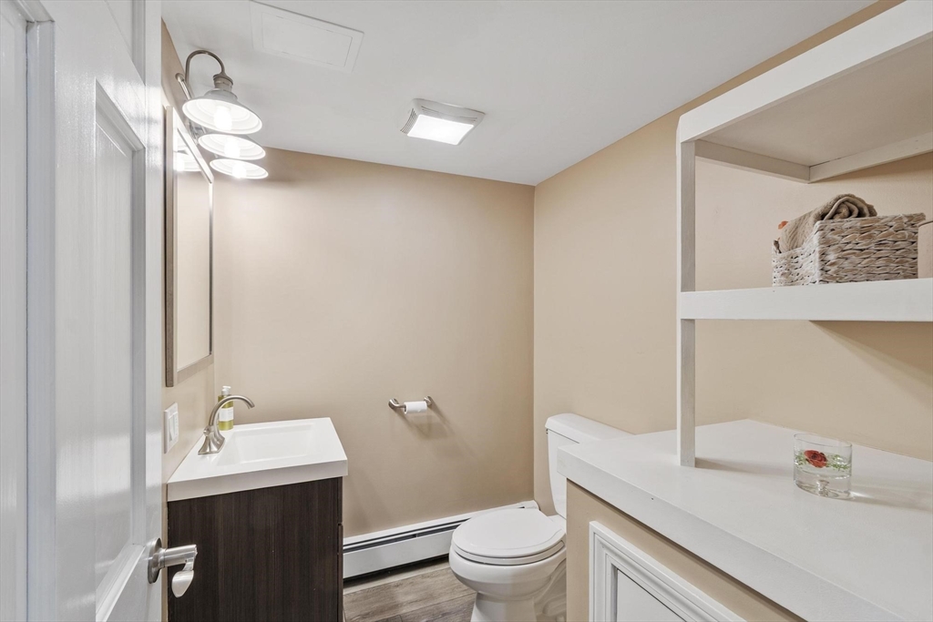 2 Greybirch Road Andover, MA 01810 - Photo 37 of 41 a bathroom with a sink a toilet and a mirror