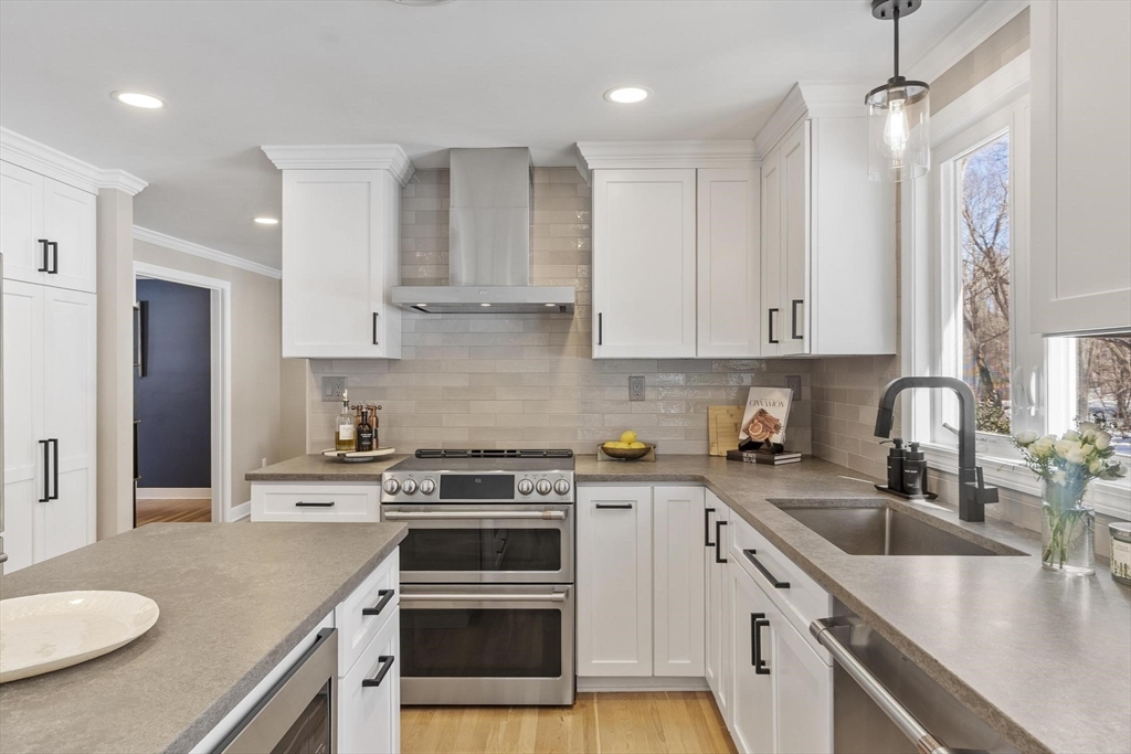 2 Greybirch Road Andover, MA 01810 - Photo 8 of 41 a kitchen with stainless steel appliances granite countertop a sink stove refrigerator and cabinets
