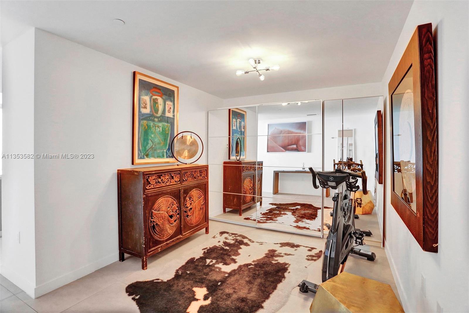 401 North Birch Road, Unit 903 Fort Lauderdale, FL 33304 - Photo 2 of 42 a view of a room with gym equipment