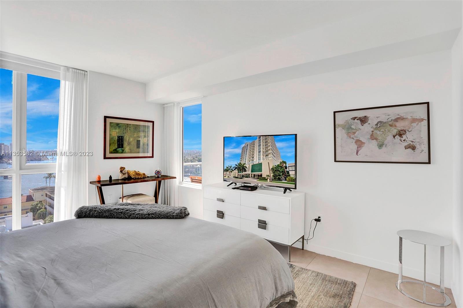 401 North Birch Road, Unit 903 Fort Lauderdale, FL 33304 - Photo 23 of 42 a bedroom with furniture and a flat screen tv