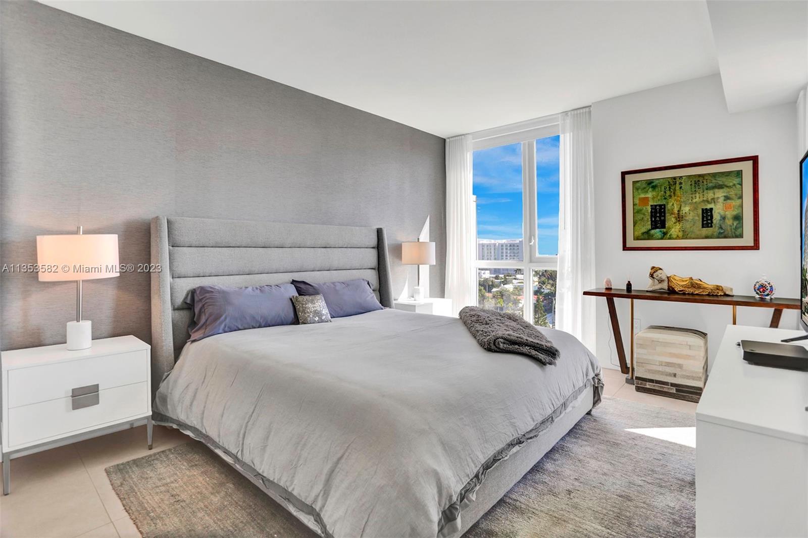 401 North Birch Road, Unit 903 Fort Lauderdale, FL 33304 - Photo 24 of 42 a bedroom with a large bed and a couch