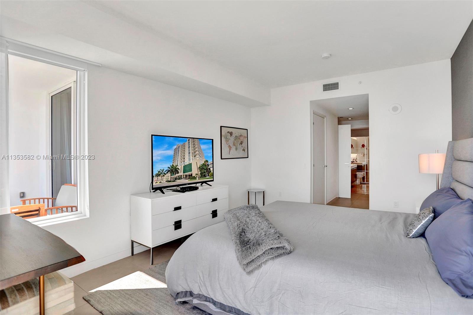 401 North Birch Road, Unit 903 Fort Lauderdale, FL 33304 - Photo 26 of 42 a bedroom with a bed and window