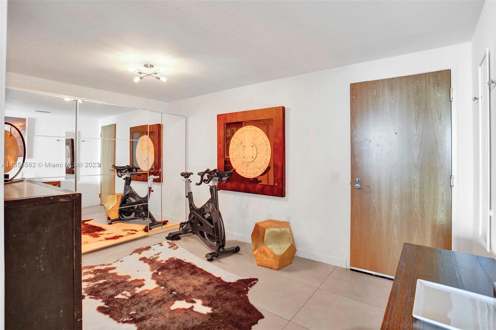 401 North Birch Road, Unit 903 Fort Lauderdale, FL 33304 - Photo 30 of 42 a view of a room with gym equipment