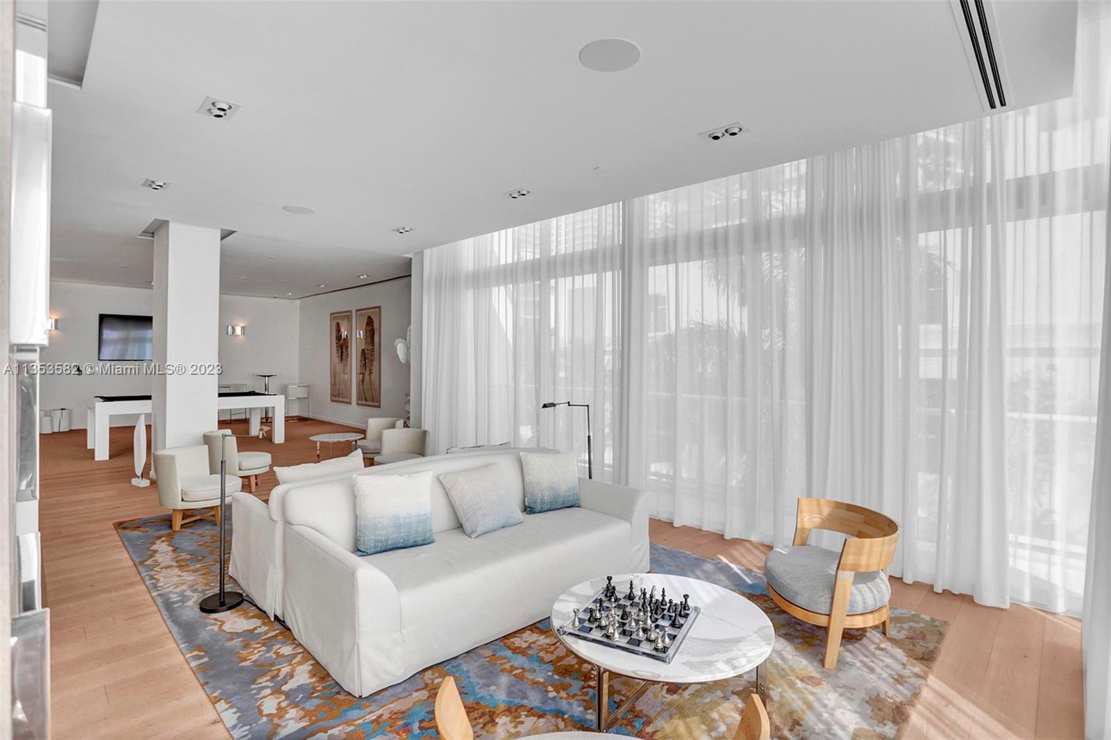 401 North Birch Road, Unit 903 Fort Lauderdale, FL 33304 - Photo 34 of 42 a living room with furniture and a table