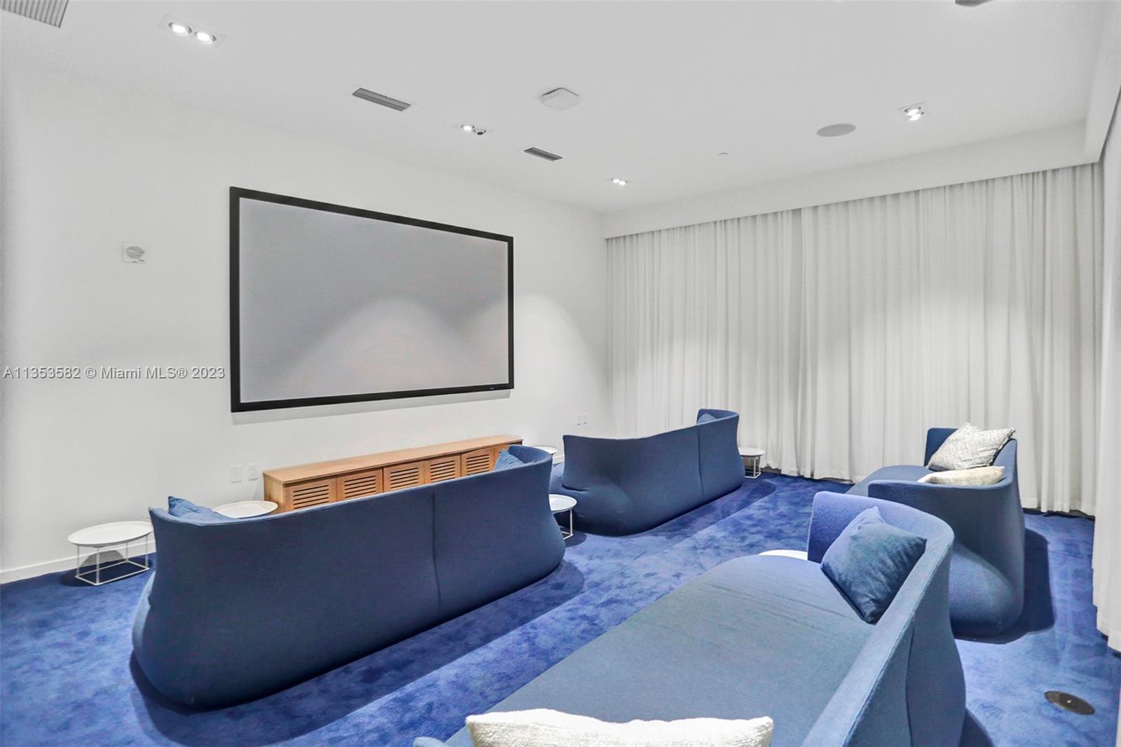 401 North Birch Road, Unit 903 Fort Lauderdale, FL 33304 - Photo 41 of 42 a living room with furniture and a flat screen tv