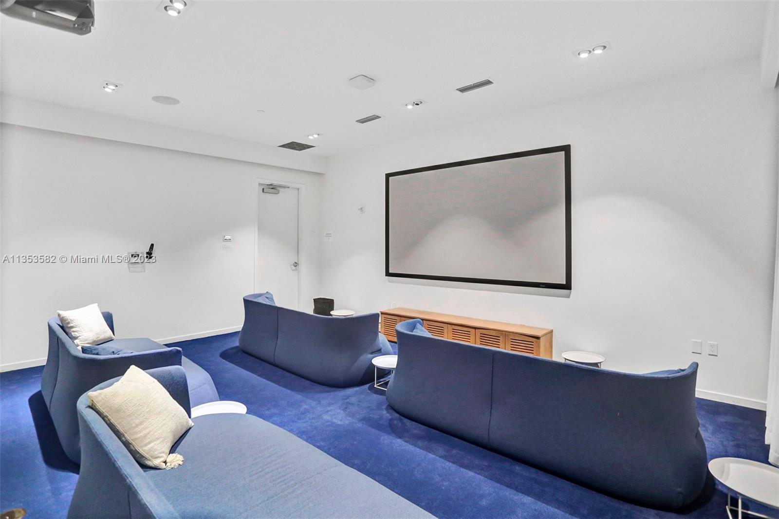 401 North Birch Road, Unit 903 Fort Lauderdale, FL 33304 - Photo 42 of 42 a living room with furniture and a flat screen tv