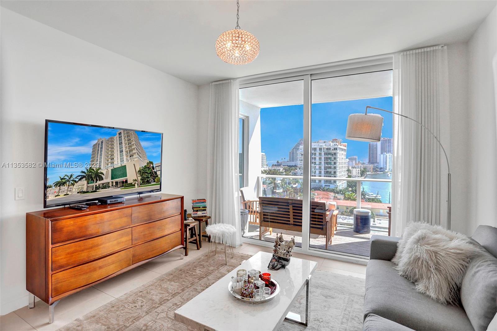 401 North Birch Road, Unit 903 Fort Lauderdale, FL 33304 - Photo 8 of 42 a living room with furniture and a window
