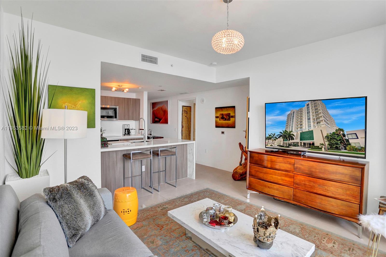 401 North Birch Road, Unit 903 Fort Lauderdale, FL 33304 - Photo 10 of 42 a living room with furniture and a table