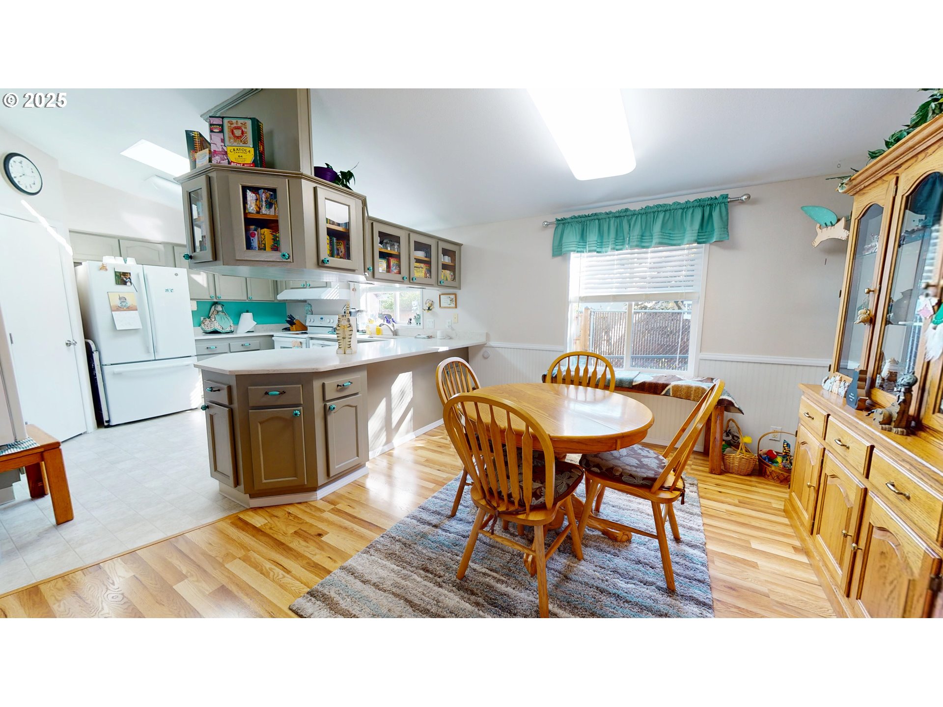 2753 Maia Loop Springfield, OR 97477 - Photo 12 of 40 a living room with stainless steel appliances a dining table and chairs