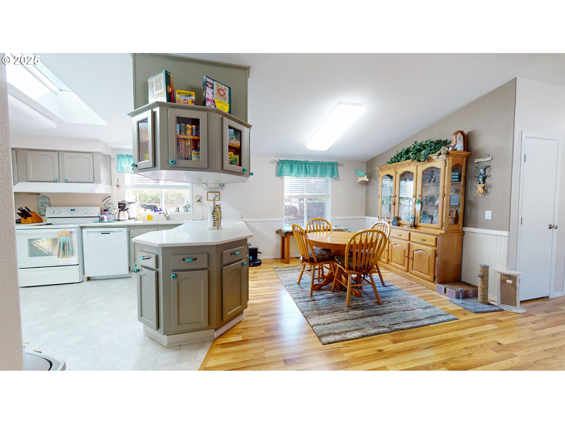 2753 Maia Loop Springfield, OR 97477 - Photo 13 of 40 a living room with stainless steel appliances kitchen island granite countertop a dining table chairs and a refrigerator