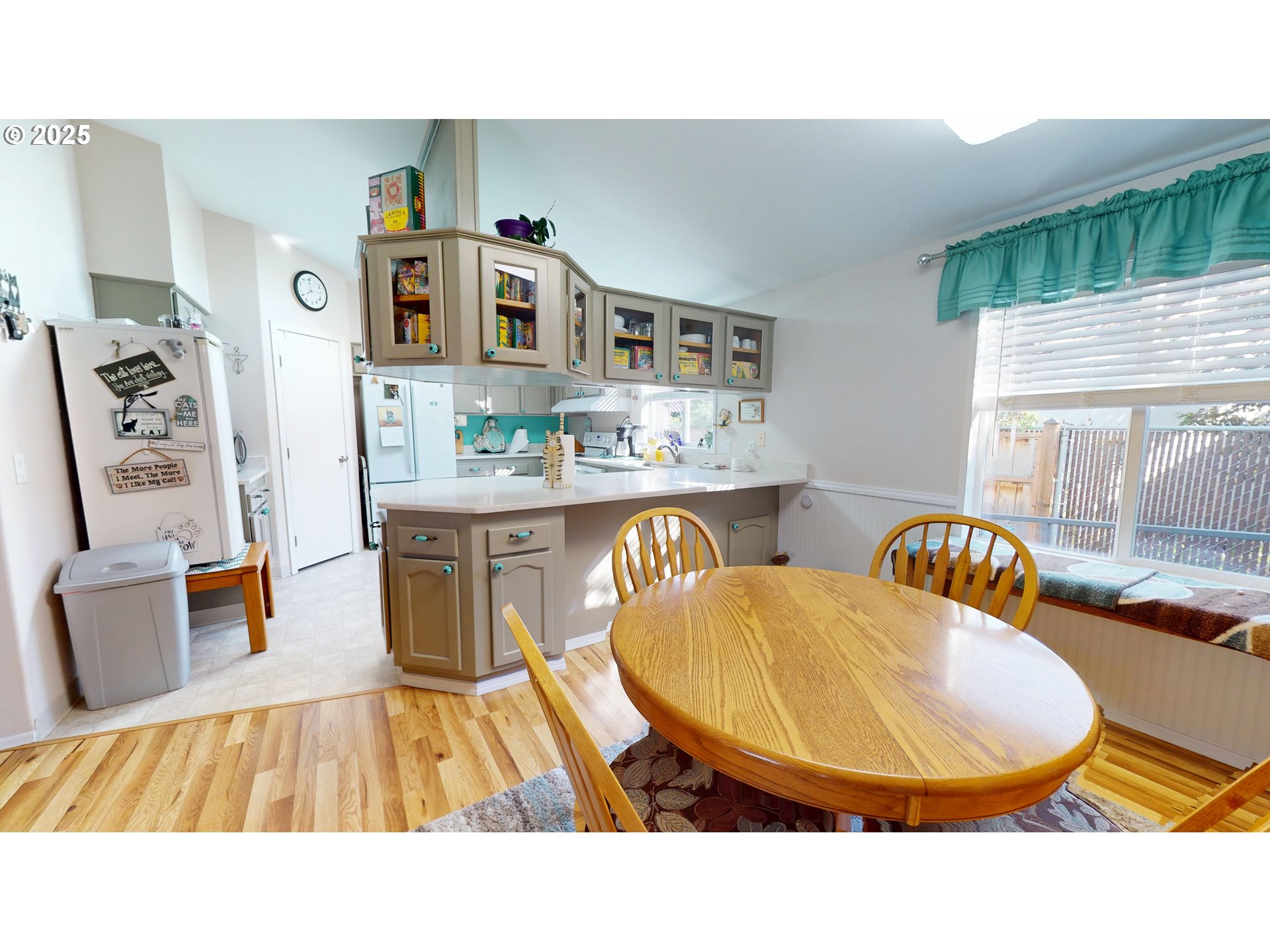 2753 Maia Loop Springfield, OR 97477 - Photo 16 of 40 a living room with stainless steel appliances furniture a rug and a large window