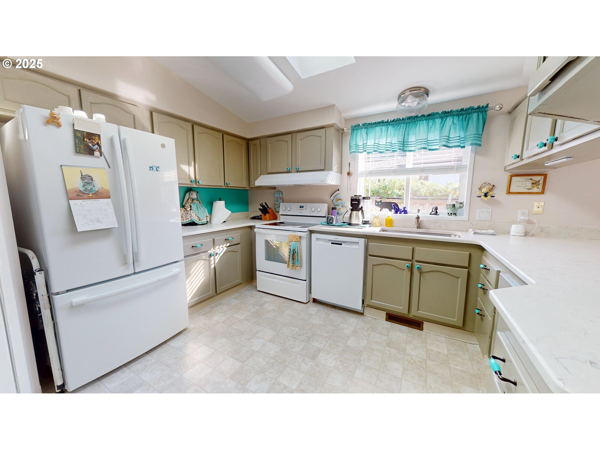 2753 Maia Loop Springfield, OR 97477 - Photo 17 of 40 a kitchen with a refrigerator a sink and cabinets