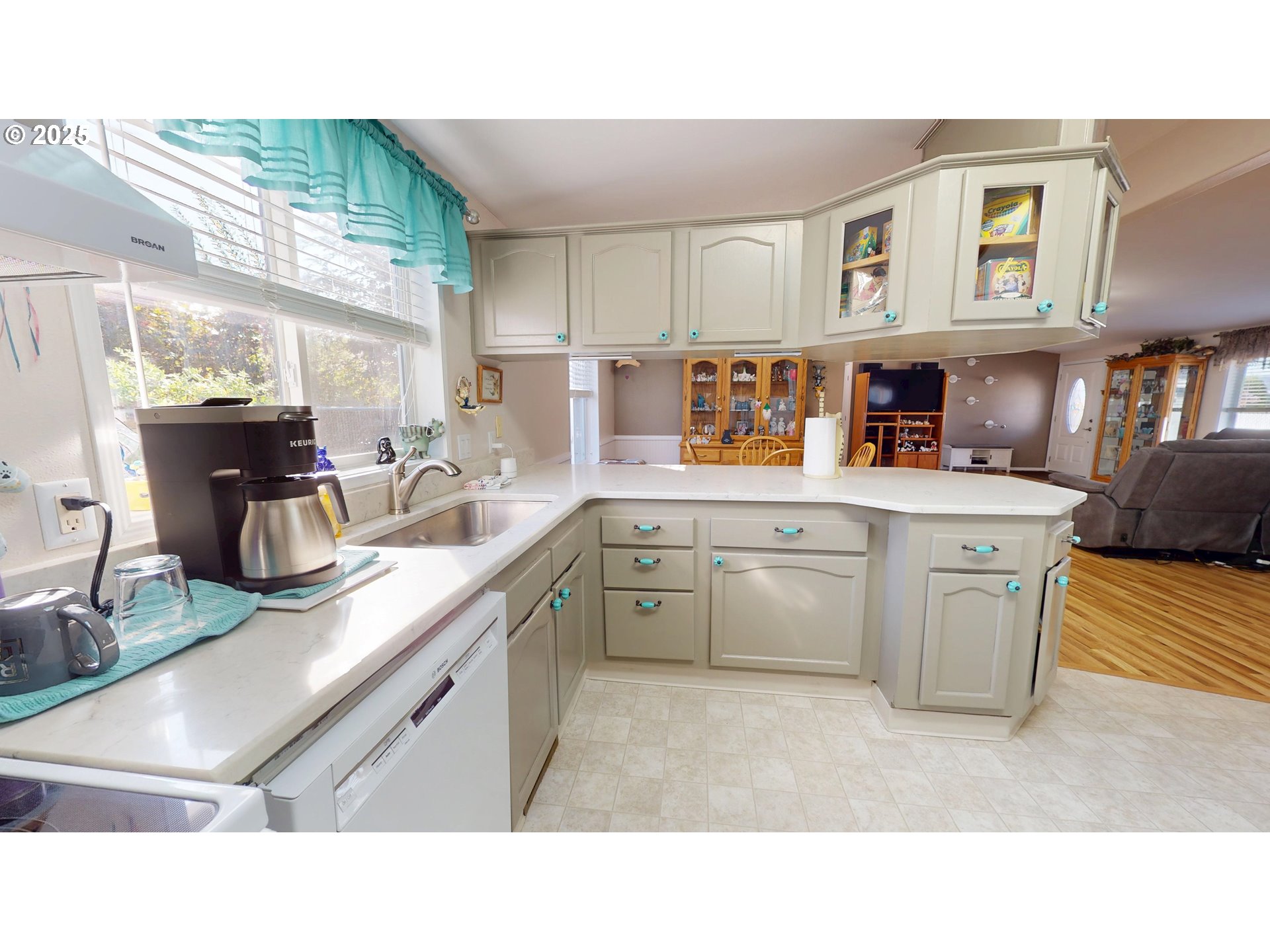 2753 Maia Loop Springfield, OR 97477 - Photo 19 of 40 a kitchen with stainless steel appliances granite countertop a sink dishwasher stove and cabinets