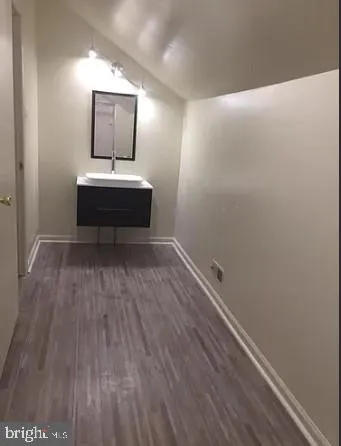 a hallway with a wooden floor