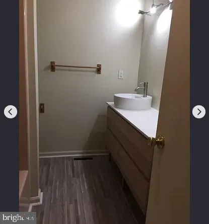 a bathroom with a sink and mirror